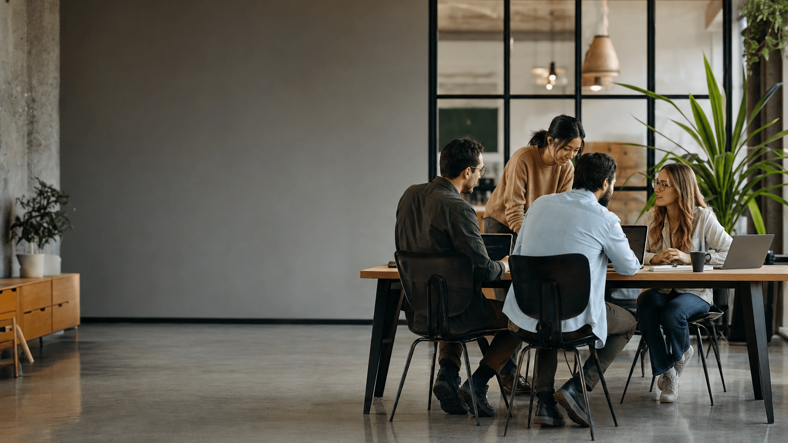 Operations team working across screens in a modern workspace